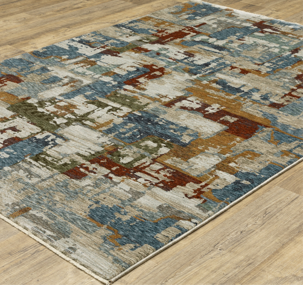 Multicolored geometric patterned rug on a wooden floor