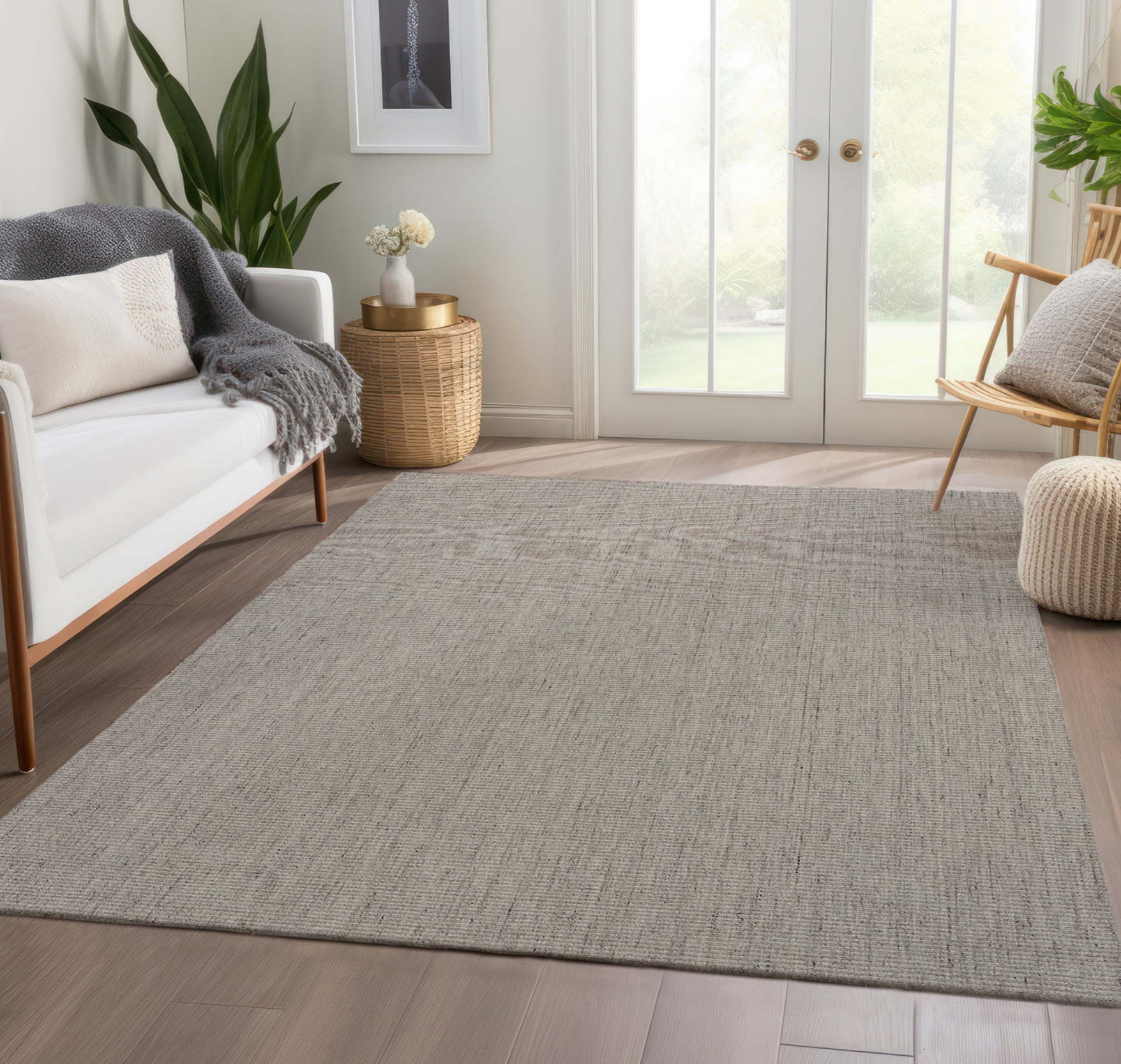Living room with a gray area rug, white sofa, and wooden chair.