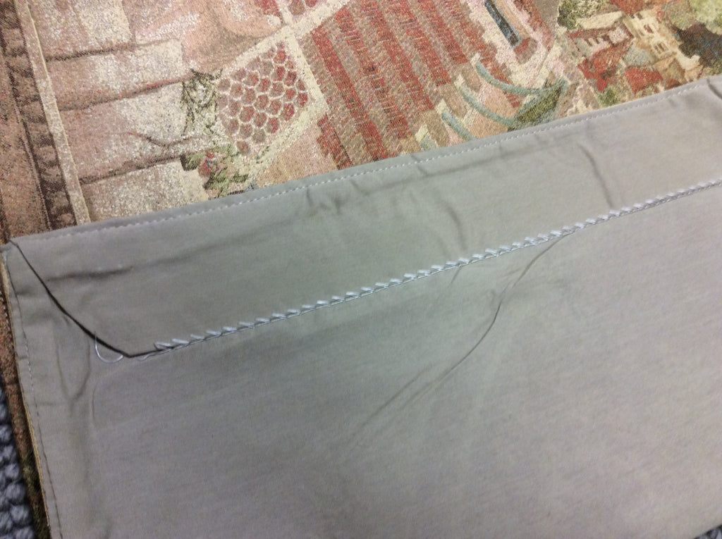 Top Back View of Hillside Town Tapestry - Quality craftsmanship with durable fabric and rod sleeve for easy hanging.