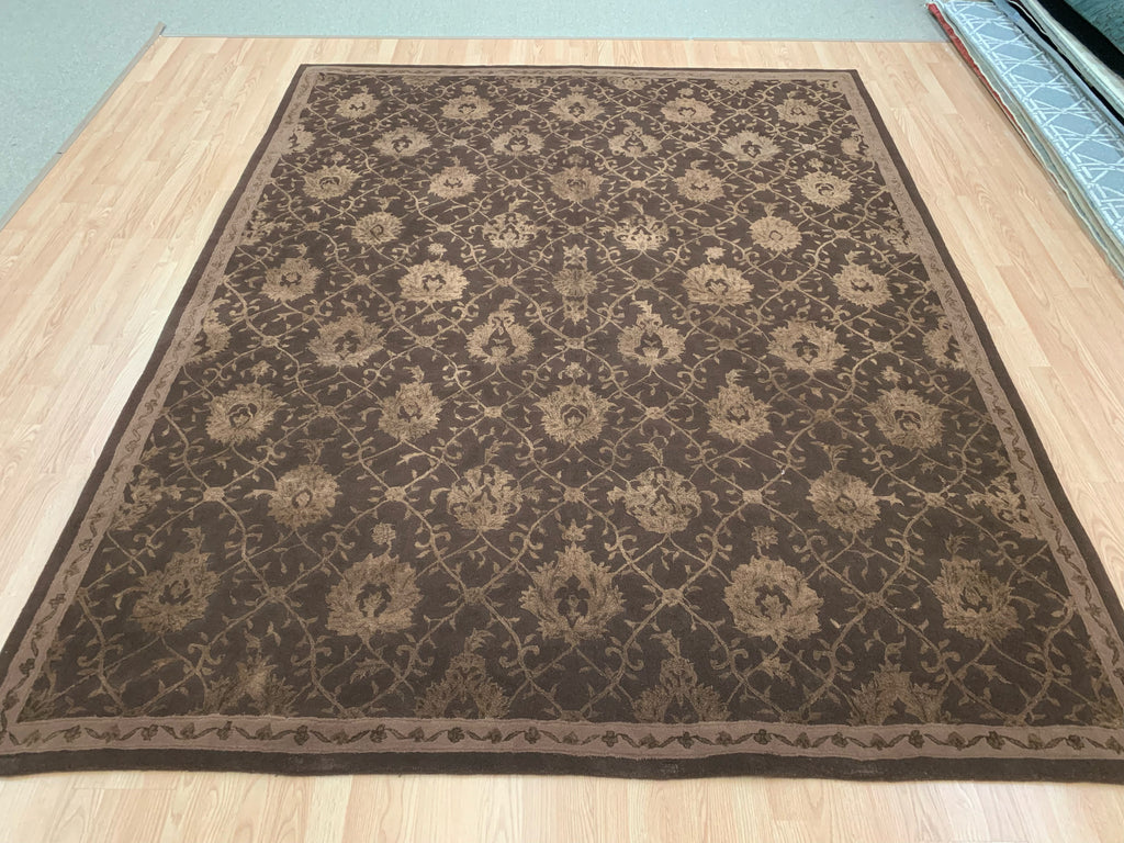7'9"x9'9" hand-tufted wool and silk rug with chocolate lattice pattern on wood floor